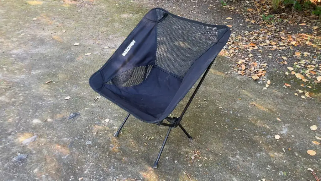 marchway-backpacking-chair The MARCHWAY folding backpacking chair sitting on the ground during a backpacking trip